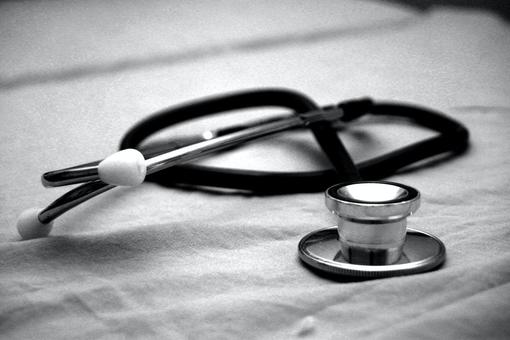 Stethoscope on a hospital bed