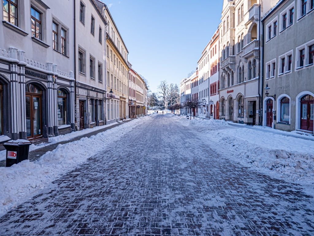Snowy street and sidewalk
