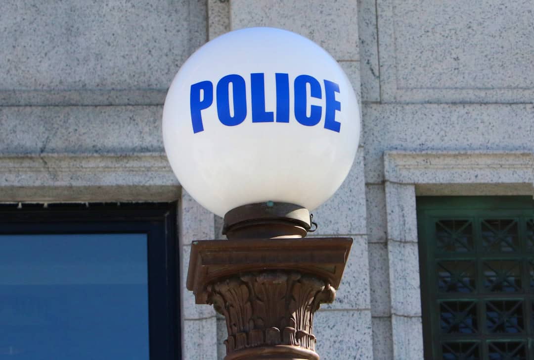 Albany police vehicles outside residence after domestic assault with reported injuries