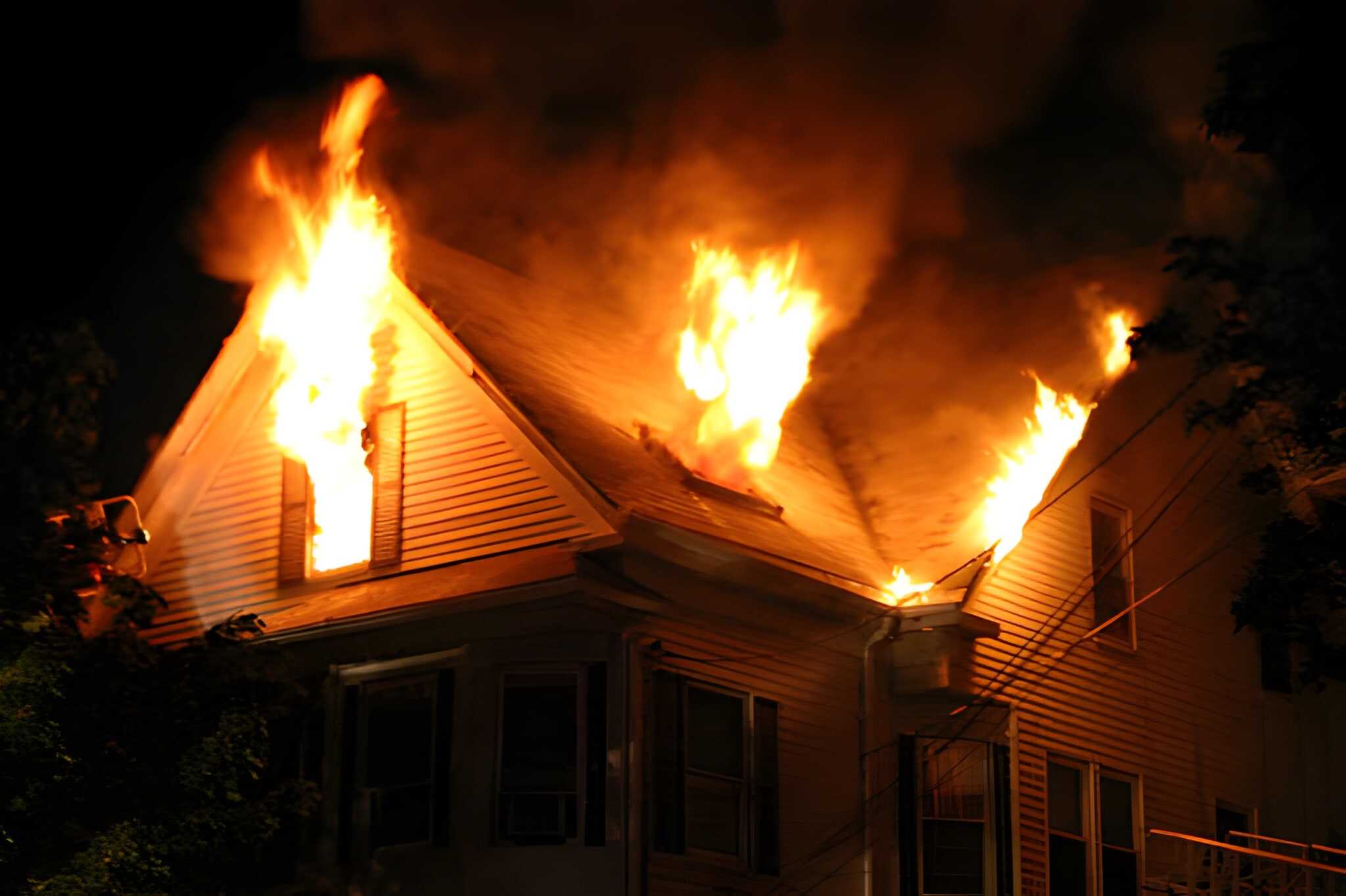 Albany firefighters outside Twiller Street home after fatal house fire that killed five people.