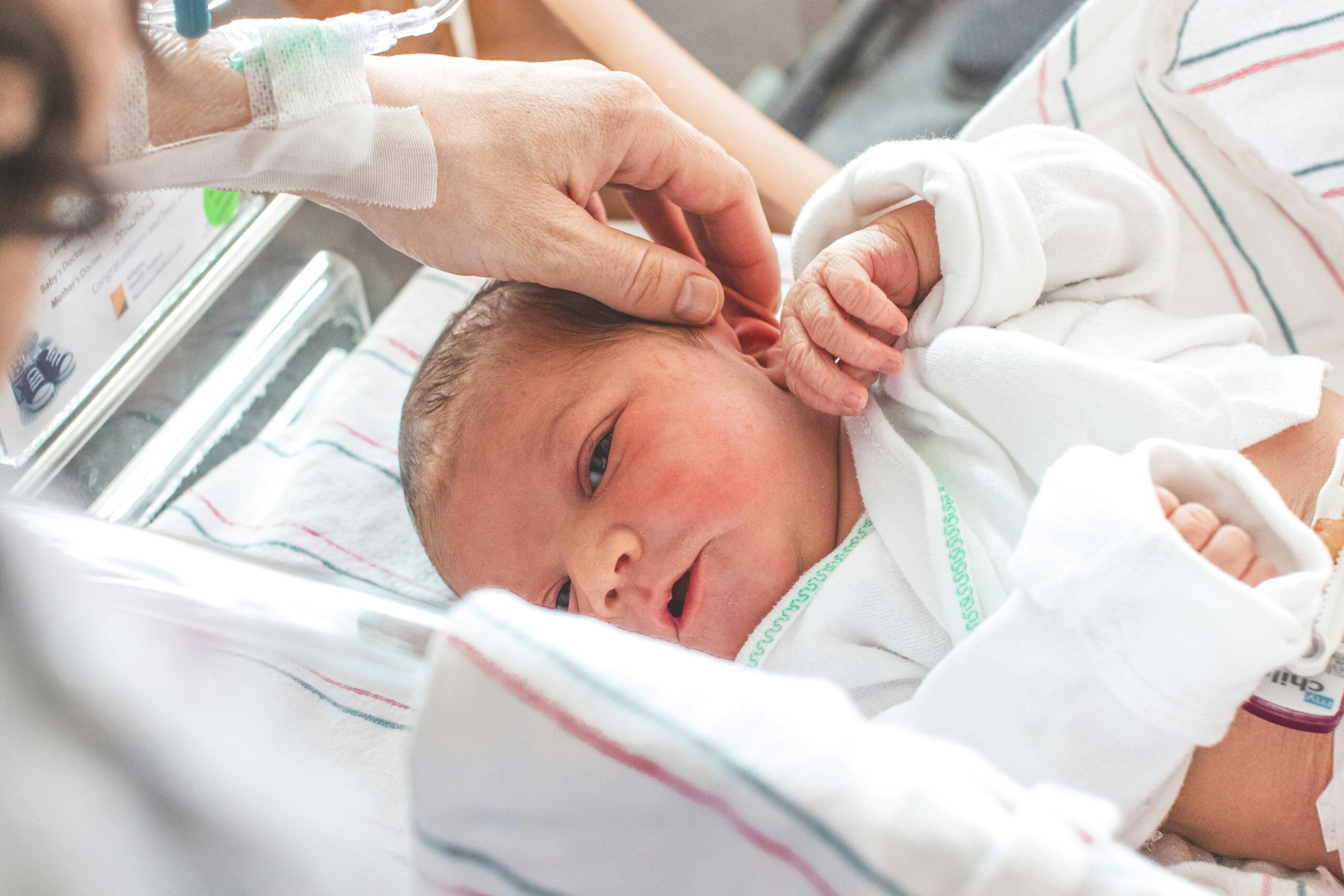 Newborn receiving care in hospital after Pitocin use, monitored for possible birth injury.
