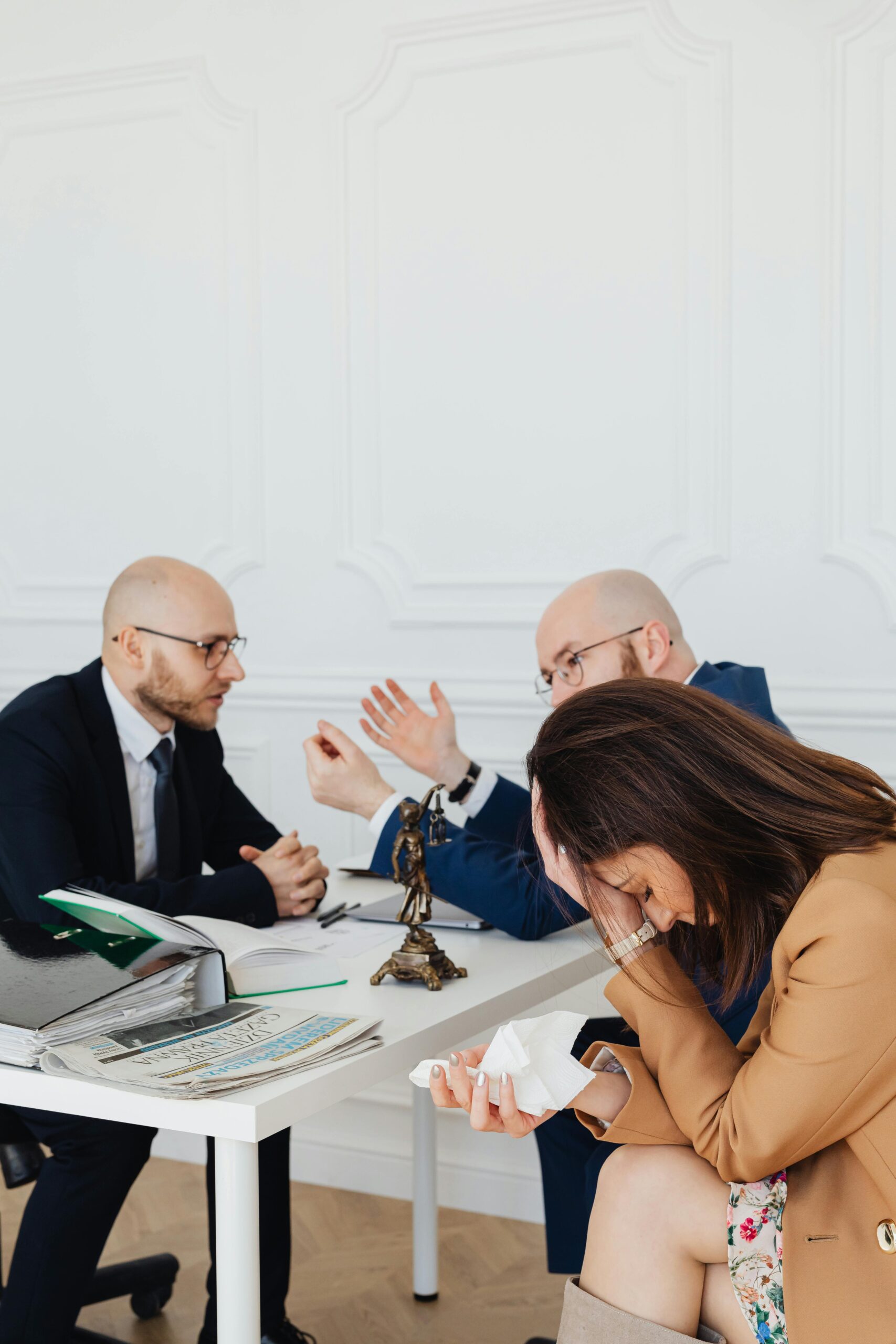 Lawyers consulting with a client, representing wrongful death legal support.