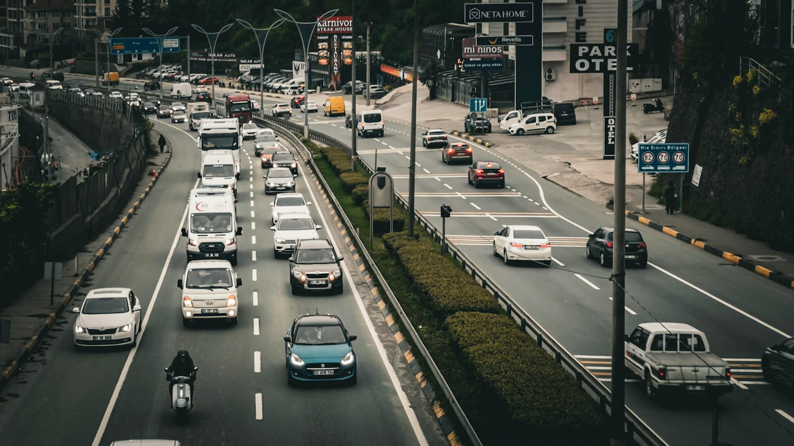 Heavy vehicle traffic on a busy urban highway in New York, highlighting potential car accident risks during daytime travel.