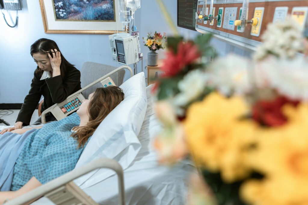 Birth Asphyxia lawyer consulting patient in hospital room for legal case in New York