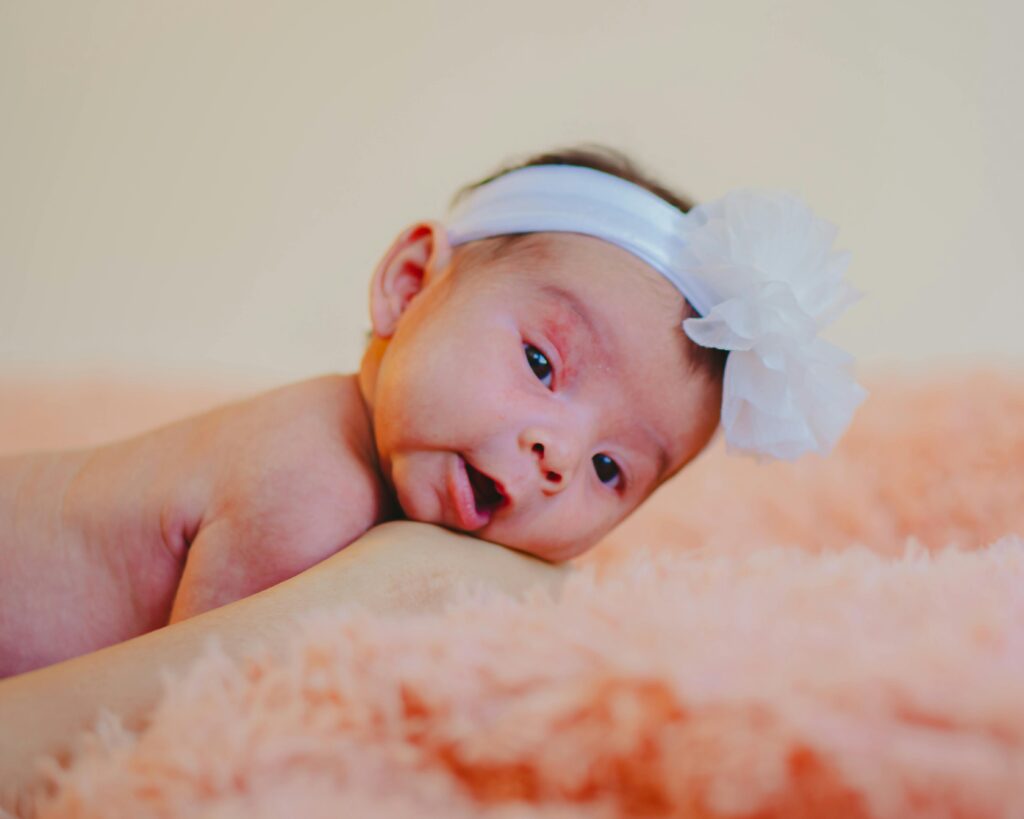 Baby lying on soft blanket, image for Cerebral Palsy birth injury lawyer page.