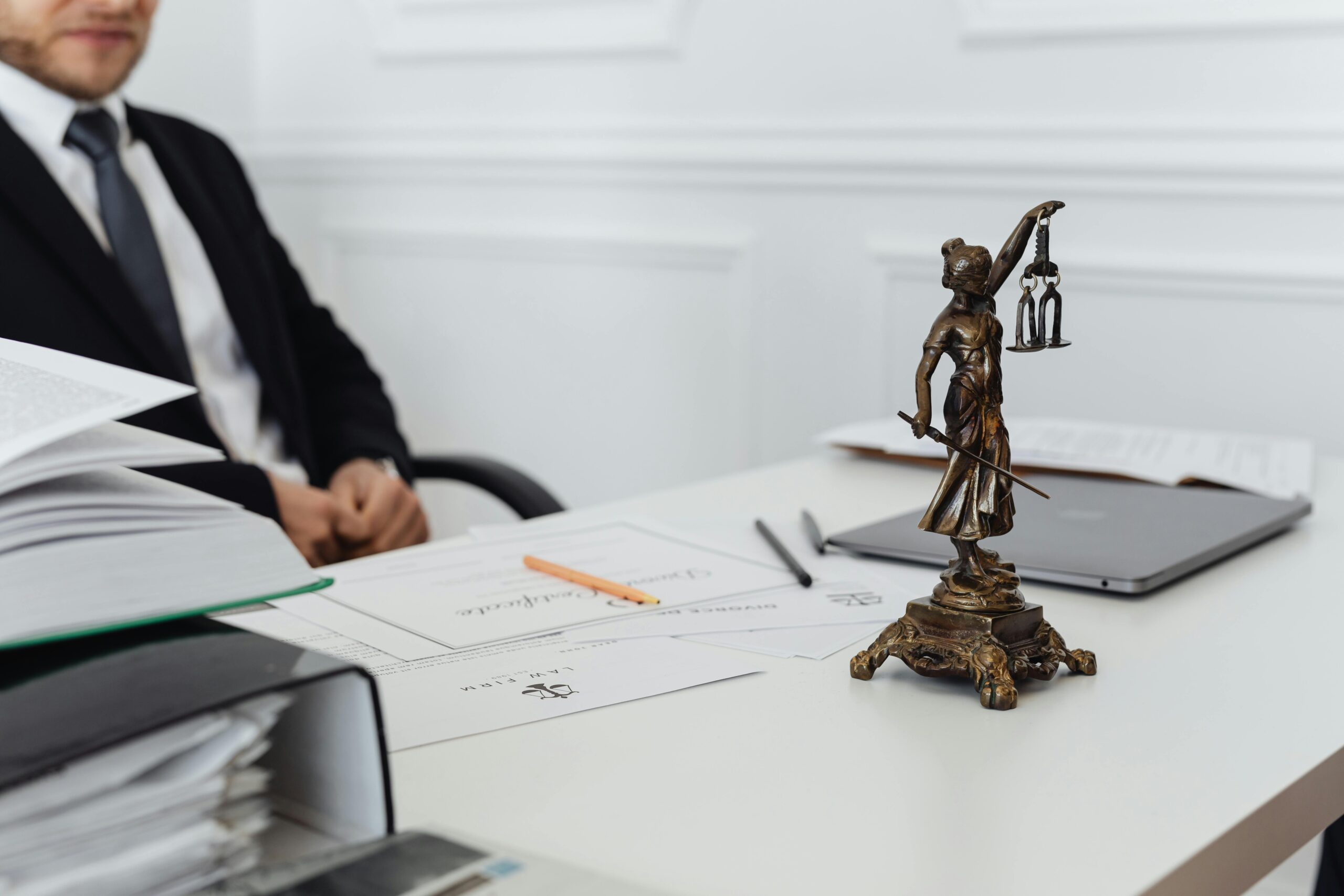 Lawyer in New York reviewing case files, assisting clients as a personal injury lawyer.