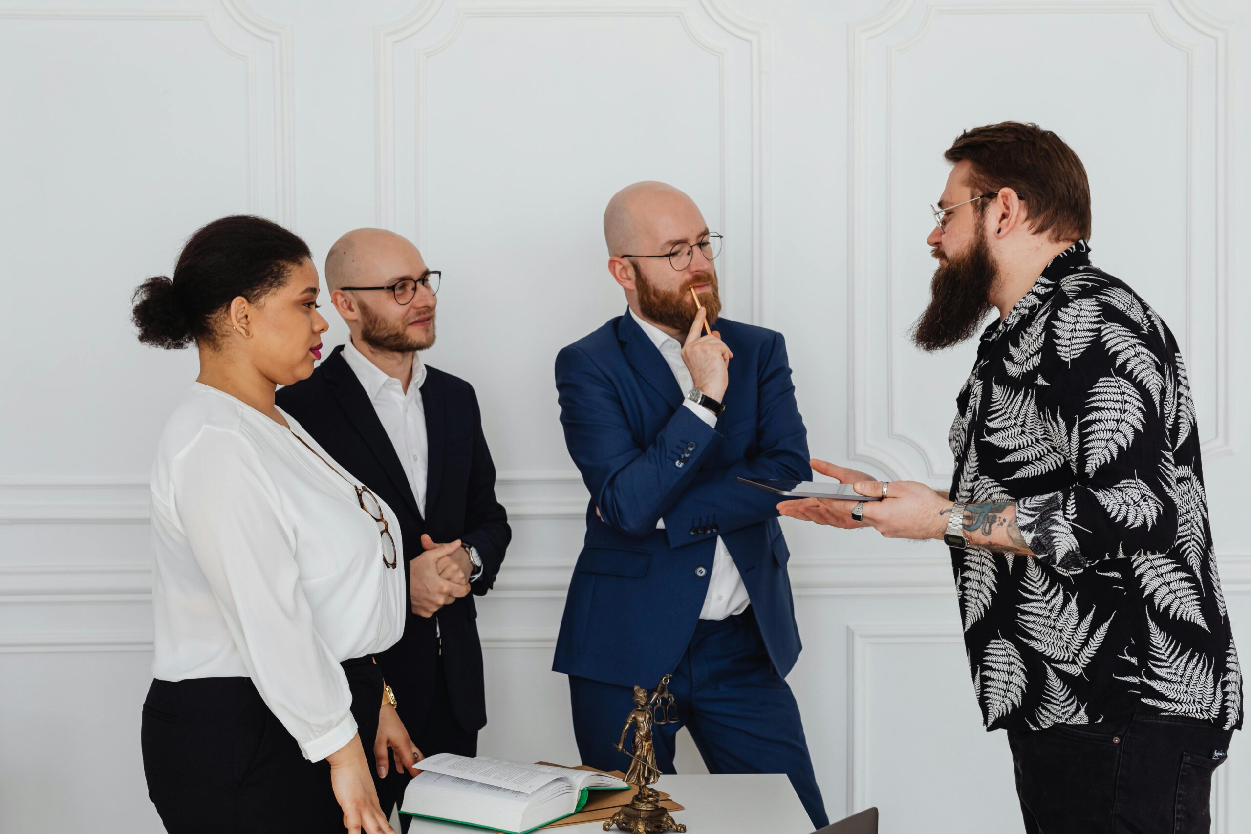 Group discussing documents, consulting a personal injury lawyer in New York office