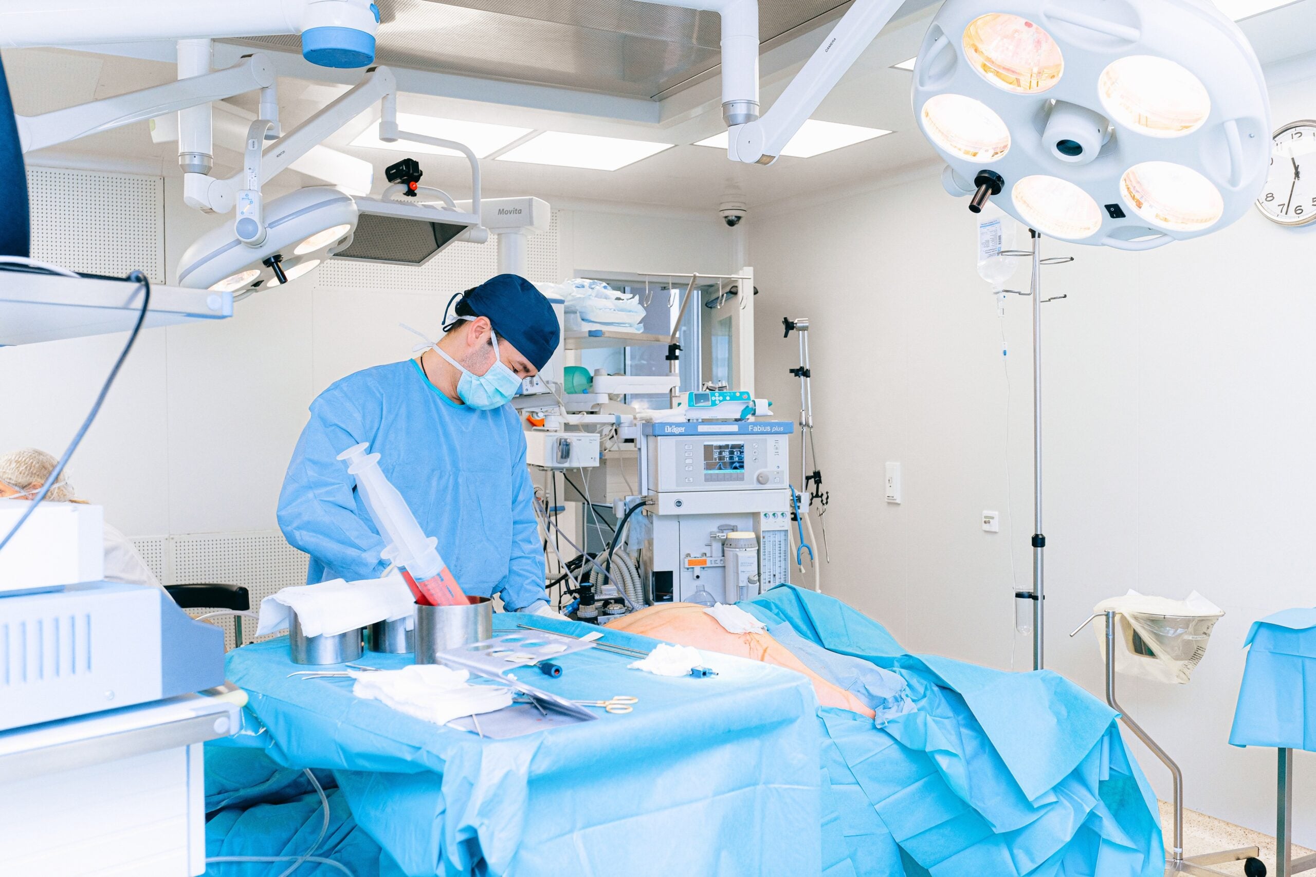 Doctor reviewing medical records, illustrating statute of limitations in malpractice cases.