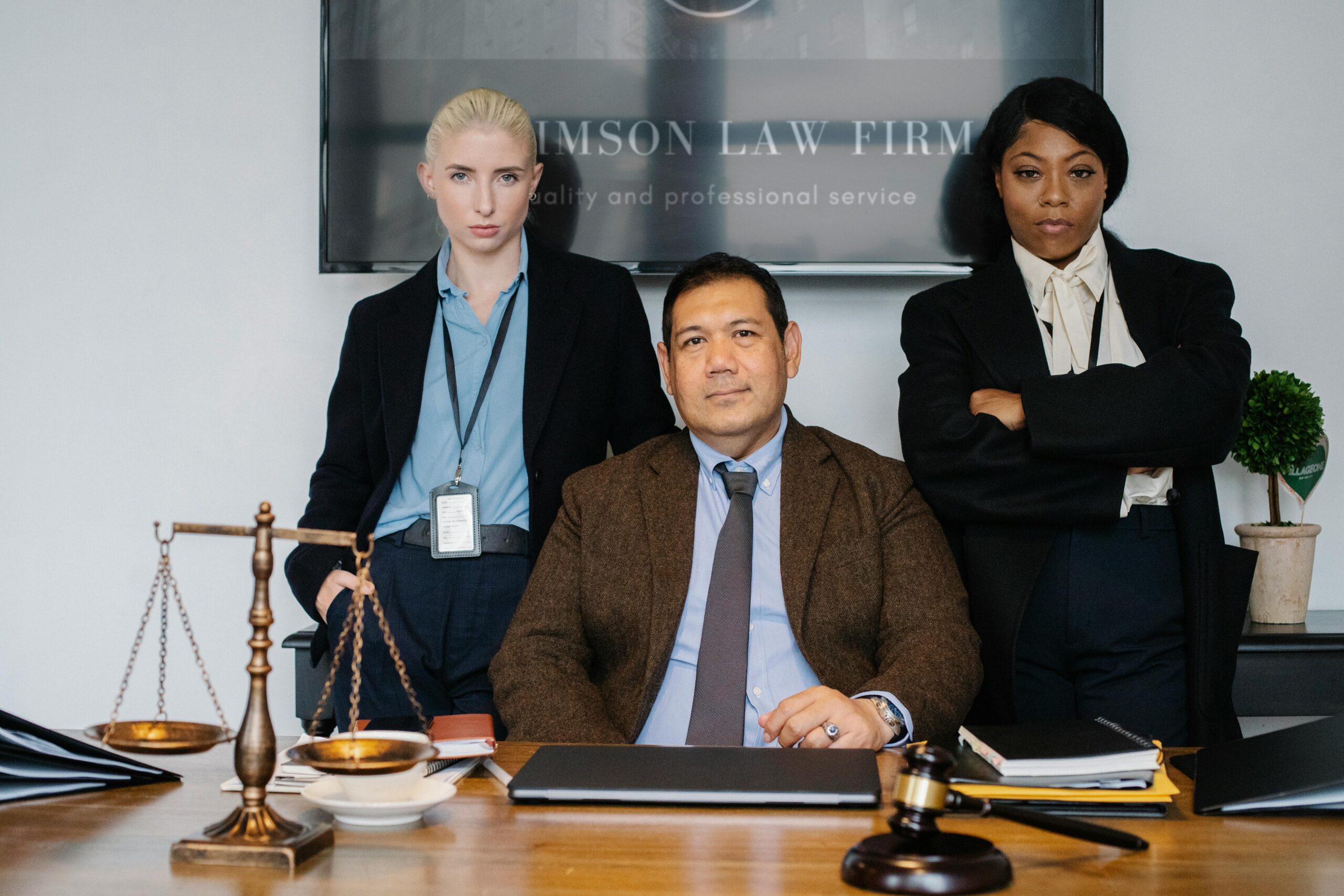 Lawyers posing in an office, representing New York Labor Law 240 legal expertise.
