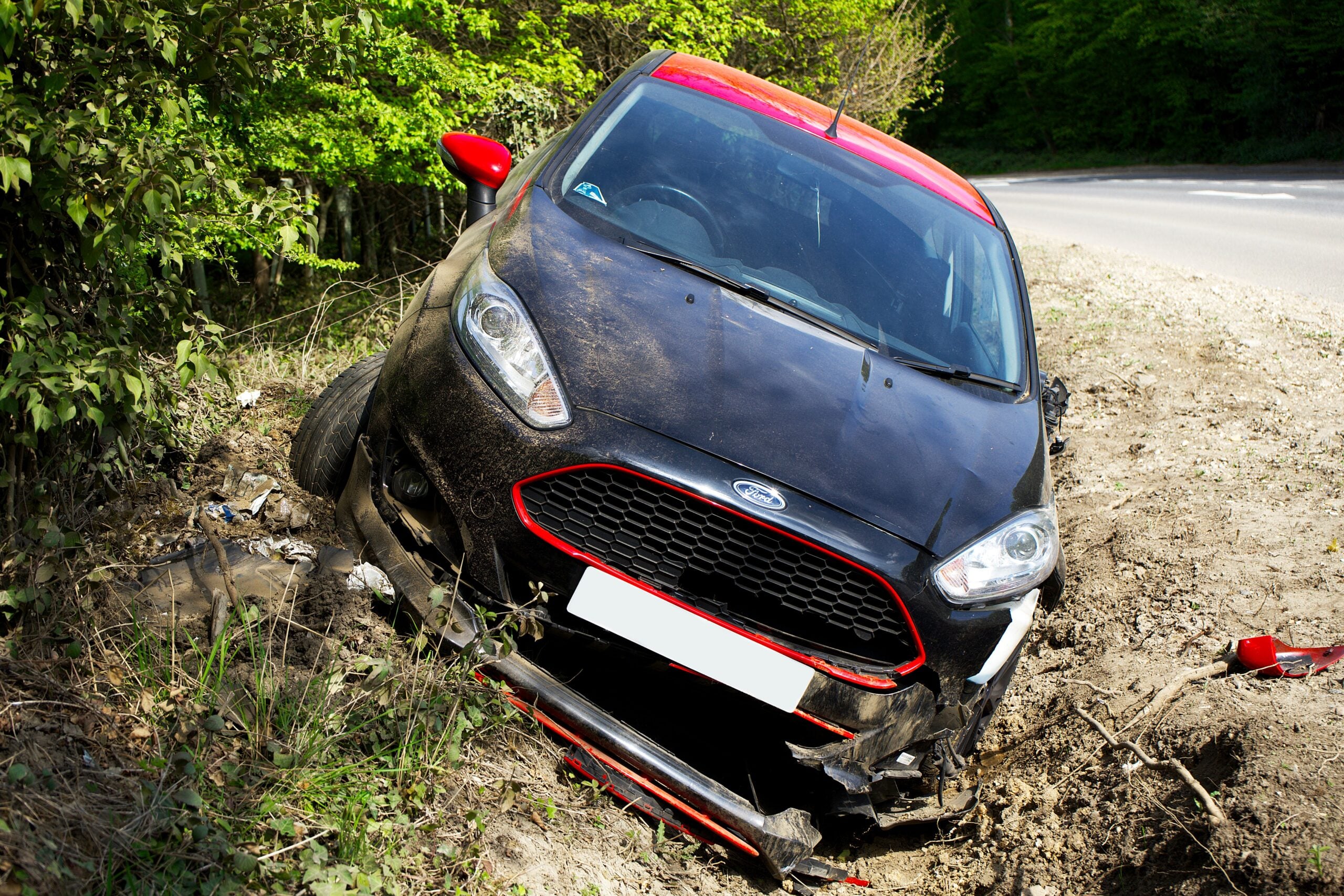 Car accident lawyer handling claims involving a damaged vehicle after a roadway crash.