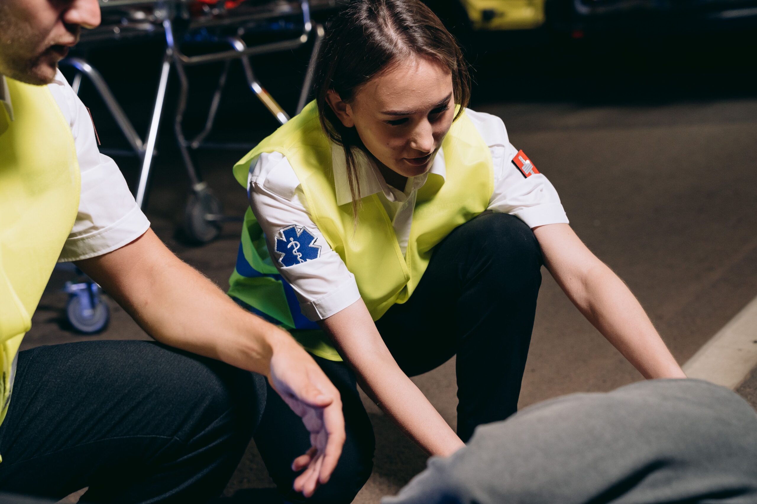 Whiplash injury victim receiving emergency medical care after a vehicle accident.